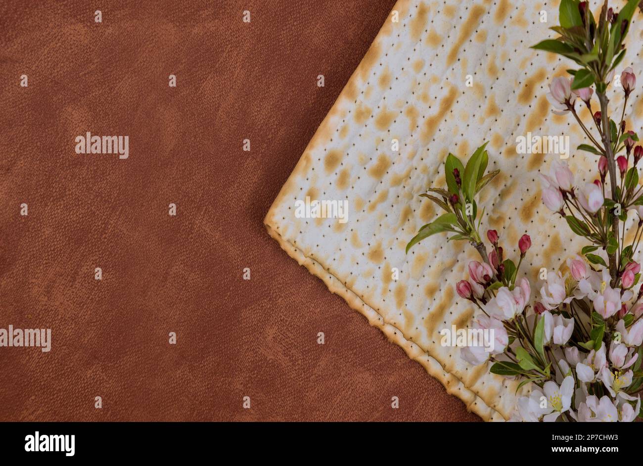 Unleavened matzah bread eaten during Passover is symbol of haste with which Jewish people left Egypt. Stock Photo
