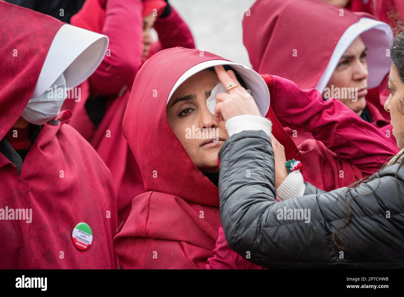 Parliament Square, London, UK. 8th March 2023. British-Iranian women, dressed as characters from The Handmaid's Tale, mark International Women's Day i Stock Photo