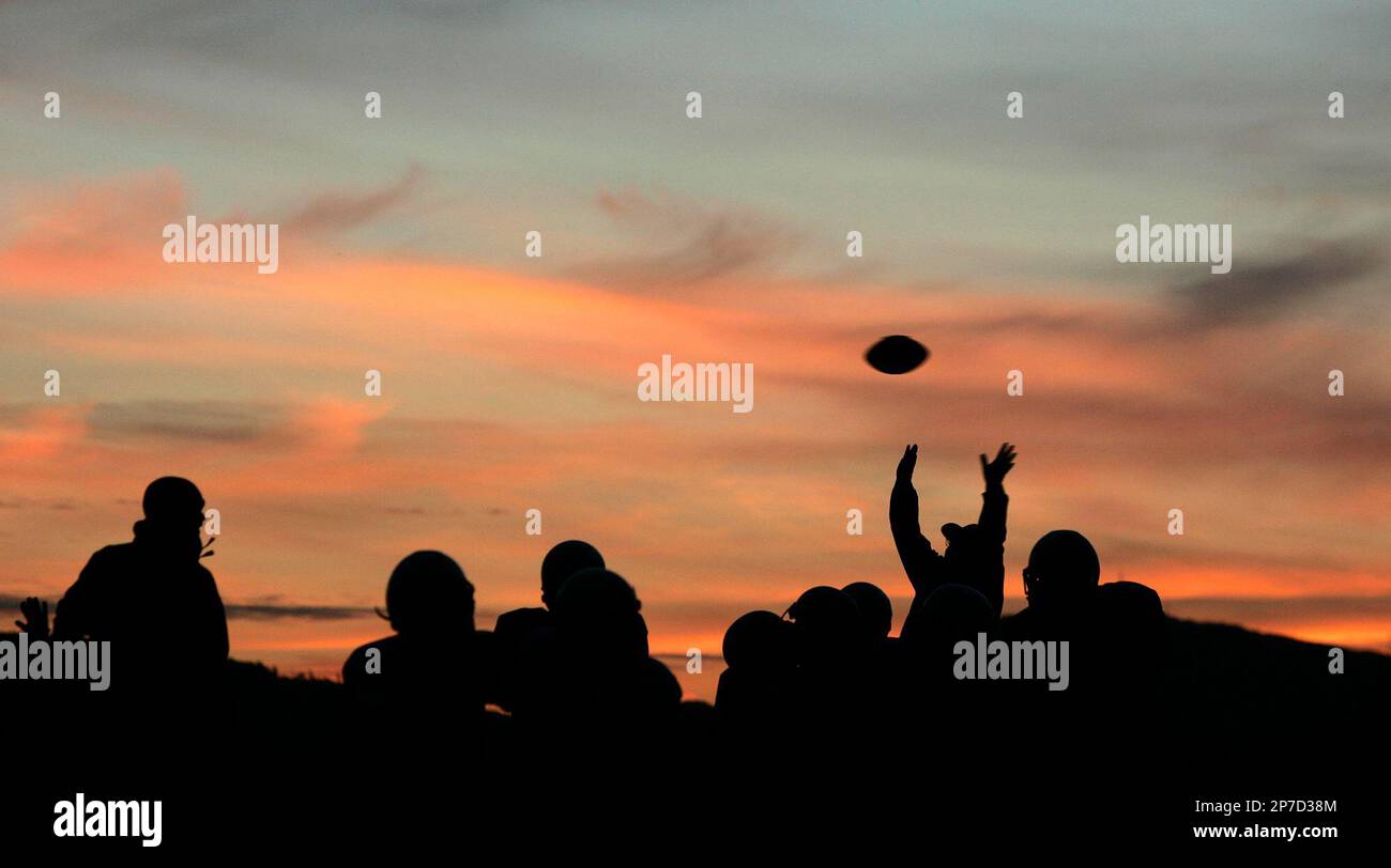 The East Bremerton Pee Wee football team and coaches run through plays