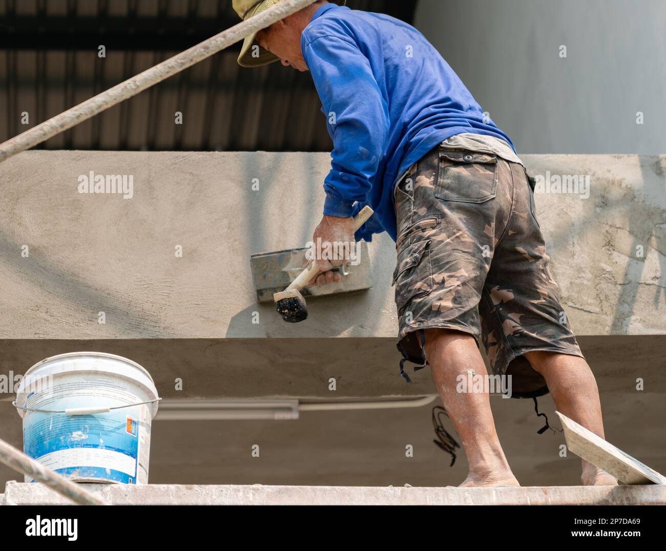 Worker Plastering Cement At Wall For Building House Work At Height Worker plastering cement at wall for building house work at height