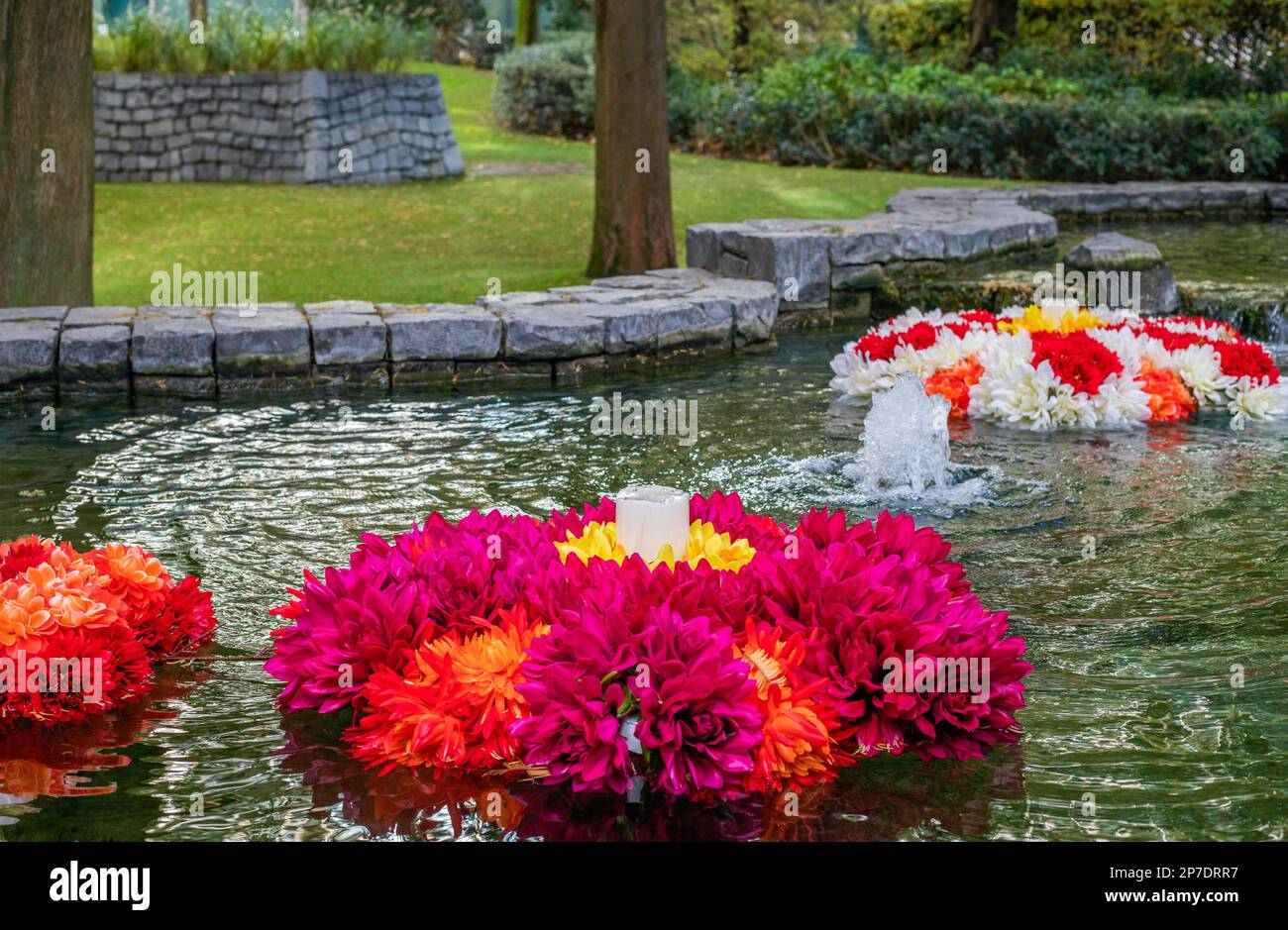 Colourful rangoli flowers float in pools of water to celebrate Diwali Stock Photo