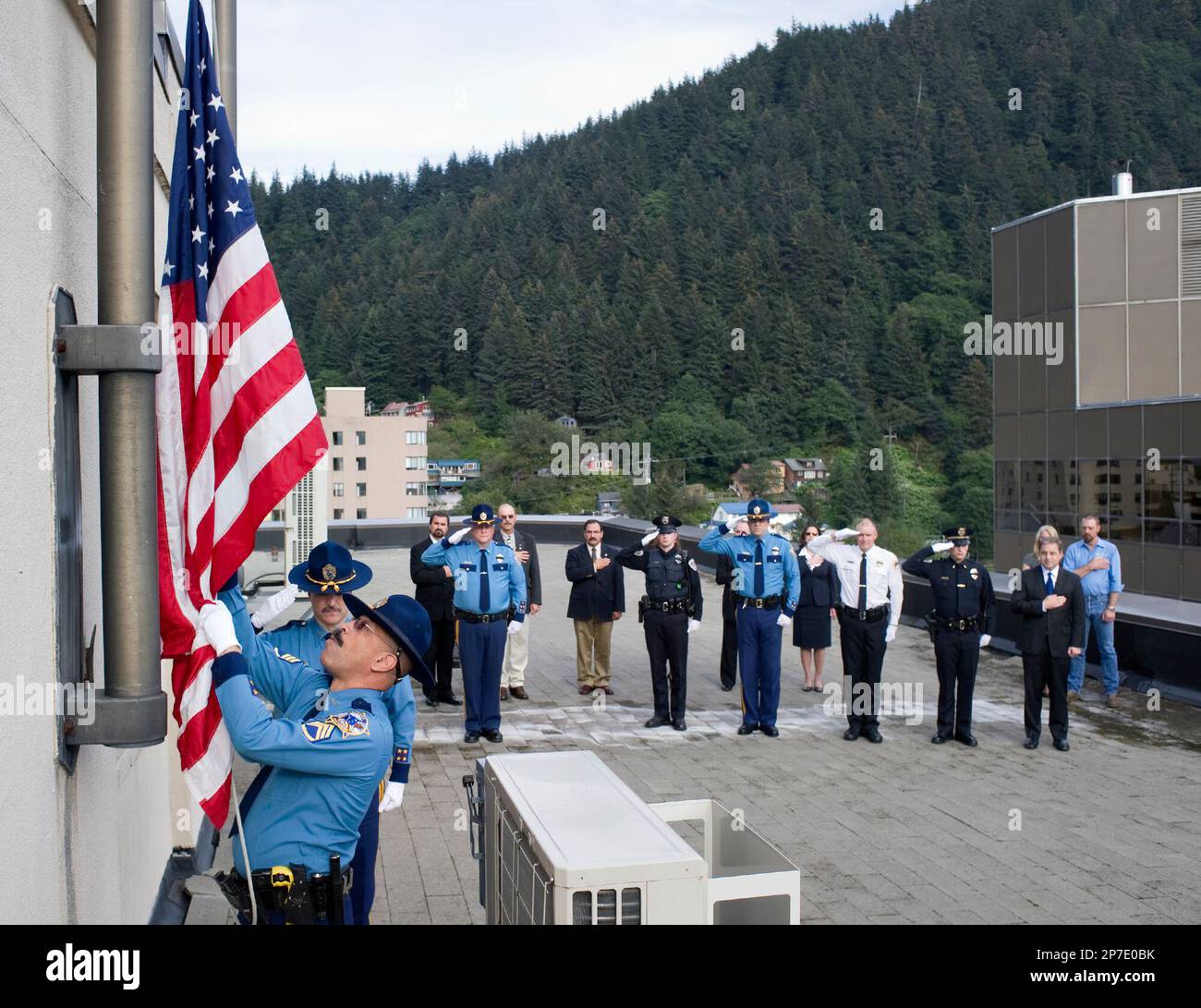 Alaska State Trooper Maurice Hughes raises the U.S. Honor Flag from the