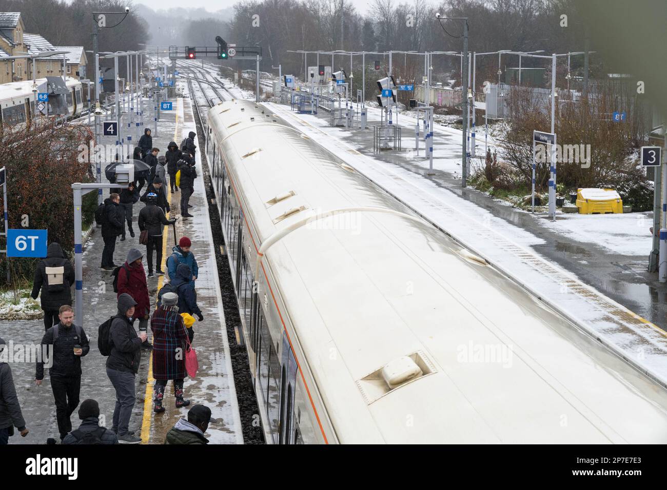 London UK, 8th March 2023.  UK Weather.   commuters boarding a morning train into London where  Heavy snowfall hit on Wednesday,,  disrupting trains in and out of the capital as an Arctic blast sweeps the UK.. Credit: Xiu Bao/Alamy Live News Stock Photo