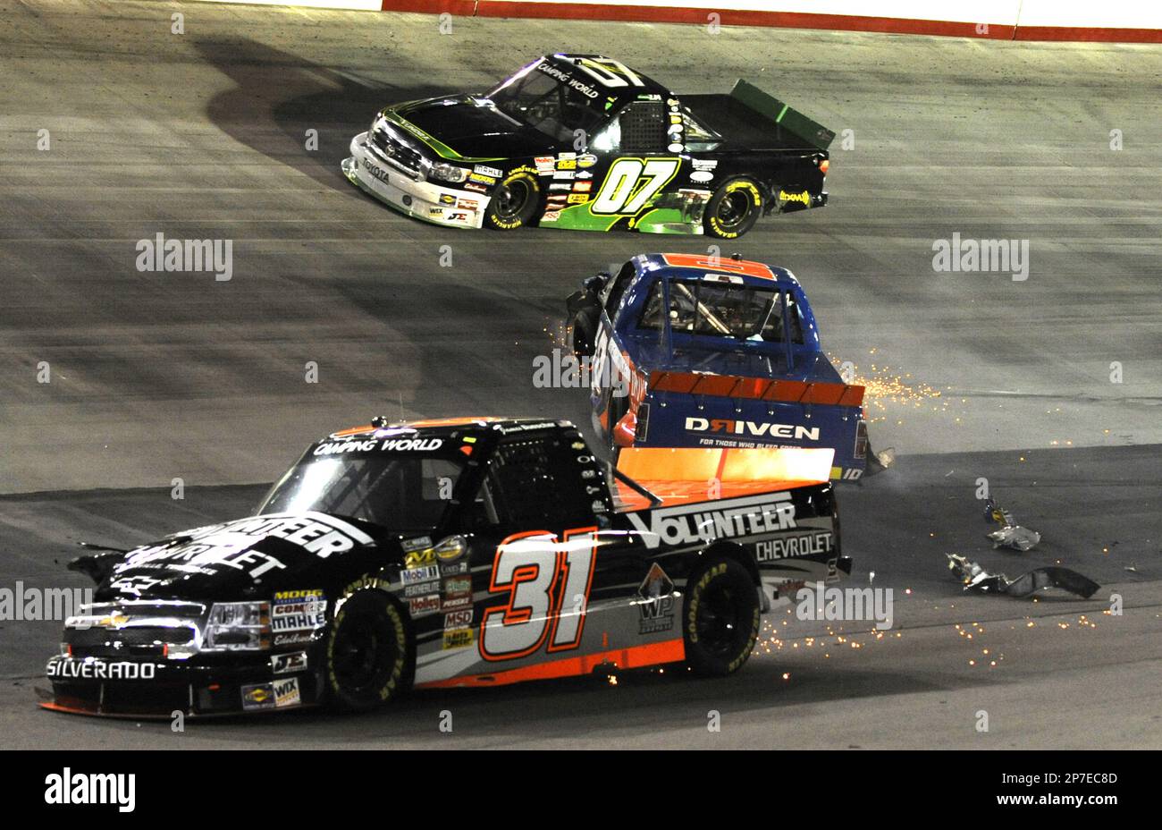 James Buescher (31) and Jennifer Cobb, middle, crash during the NASCAR ...