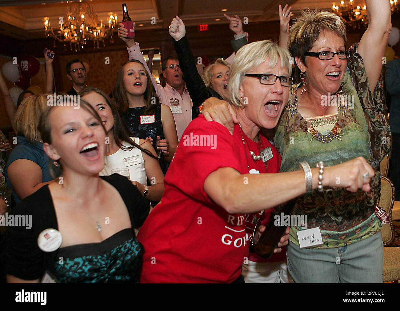 Kathy Coon, center, Alison Lass, right, and others react to news of a county win for Matt Mead