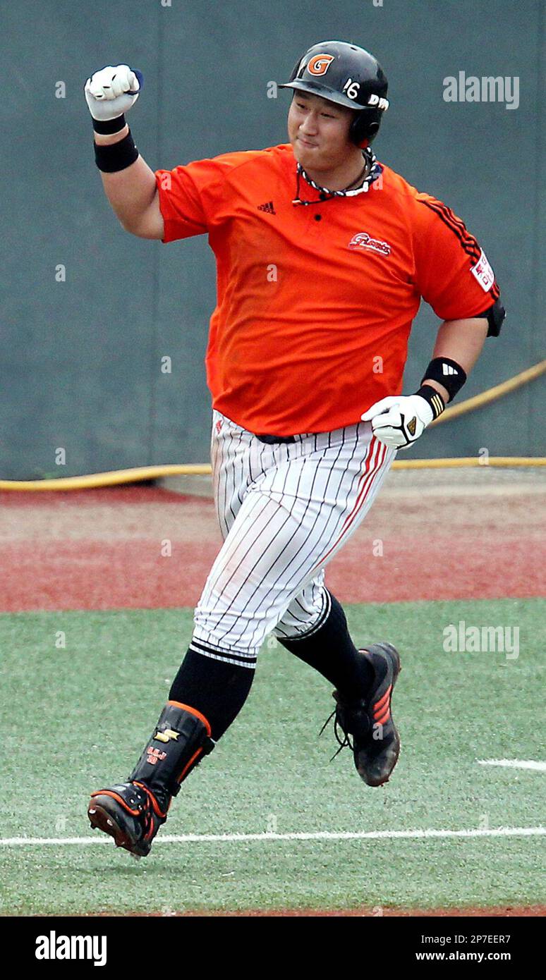 South Korean slugger Lotte Giants Lee Dae-ho celebrates after hitting a three-run home run as a world record with 9 consecutive-game home runs in the second inning of a professional baseball game