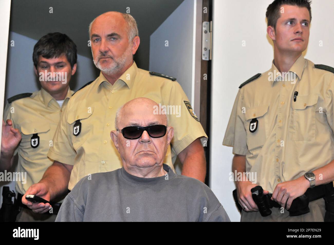 Accused Nazi death camp guard John Demjanjuk arrives in a courtroom in ...