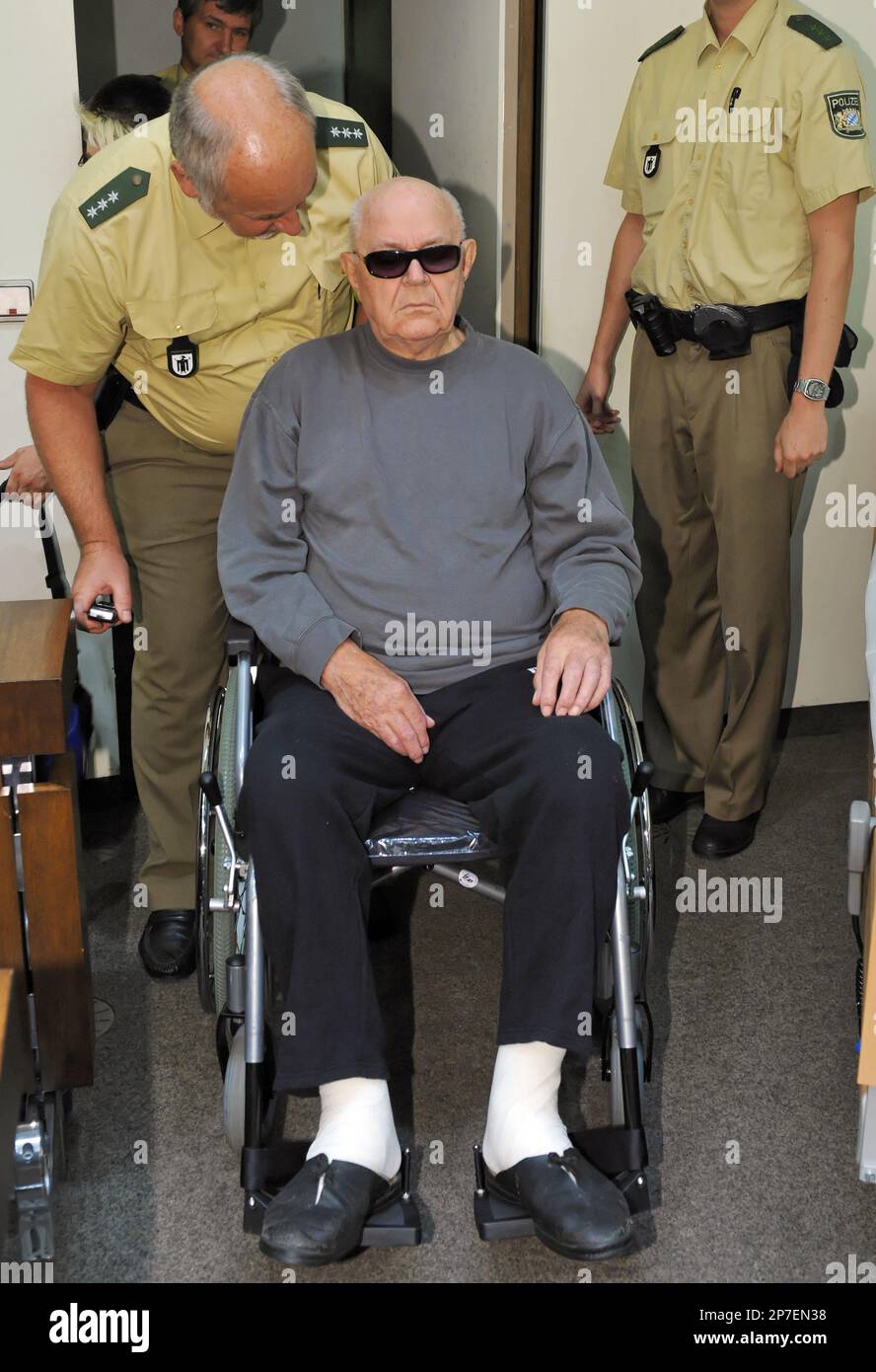 Accused Nazi death camp guard John Demjanjuk arrives in a courtroom in ...