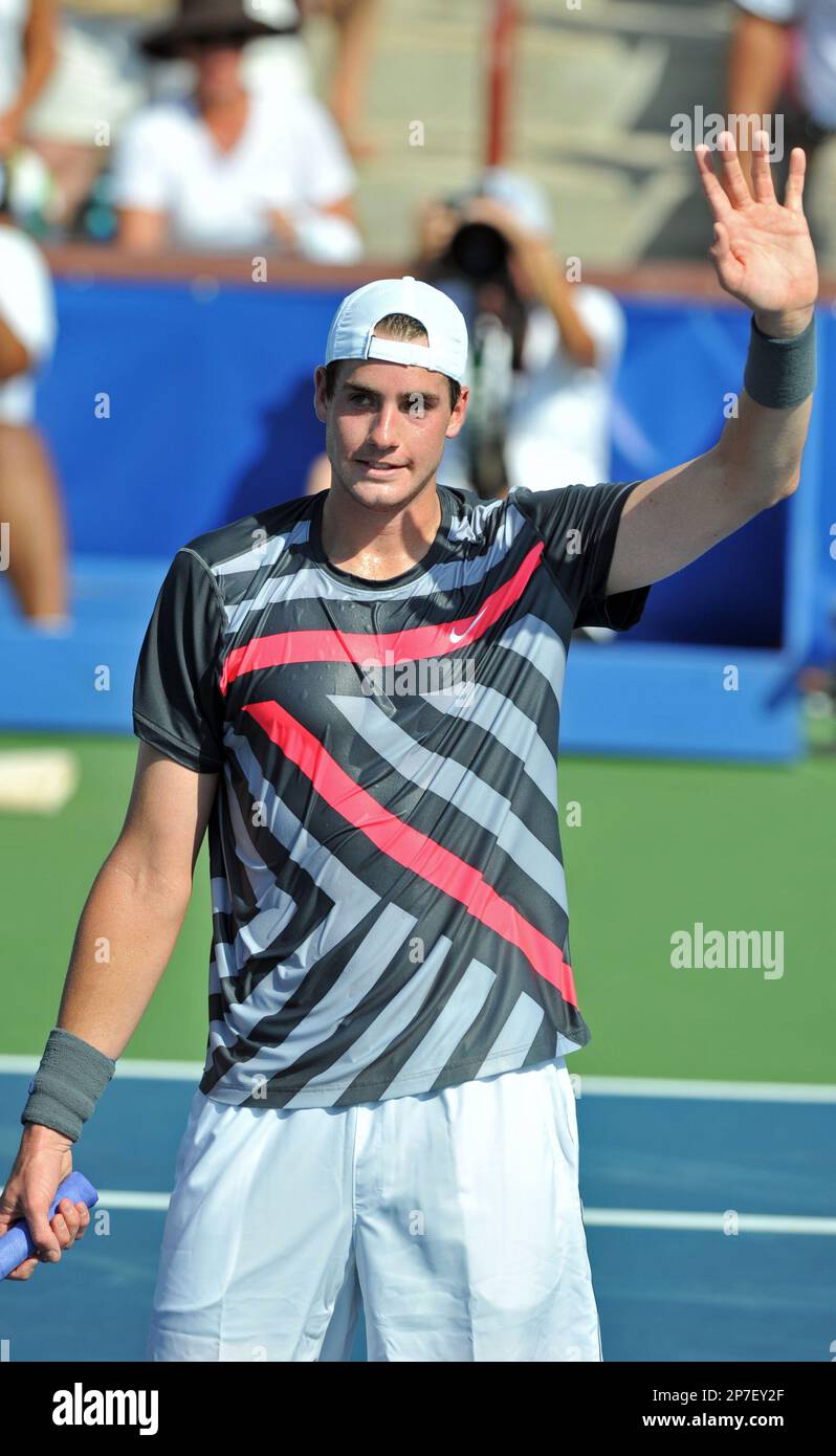 John Isner celebrates his victory over Michael Russell in the opening round of the Atlanta Tennis Championships at the Atlanta Athletic Club in Johns Creek