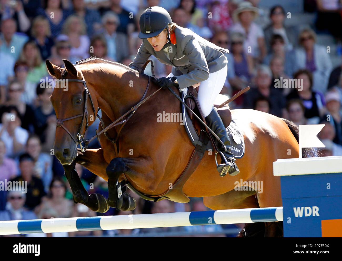 Meredith Michaels-Beerbaum from Germany riding her horse Shutterfly jumps over an obstacle in the first of two rounds in the jumping competition Rolex Grand Prix, The Grand Prix of Aachen, at the