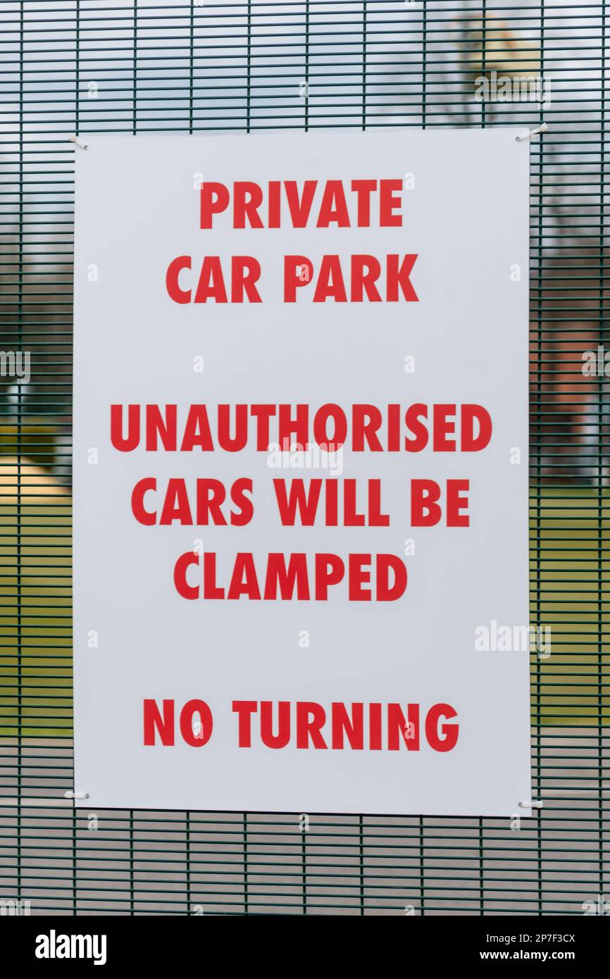 Sign: Private Car Park, Unauthorised Cars will be Clamped Stock Photo