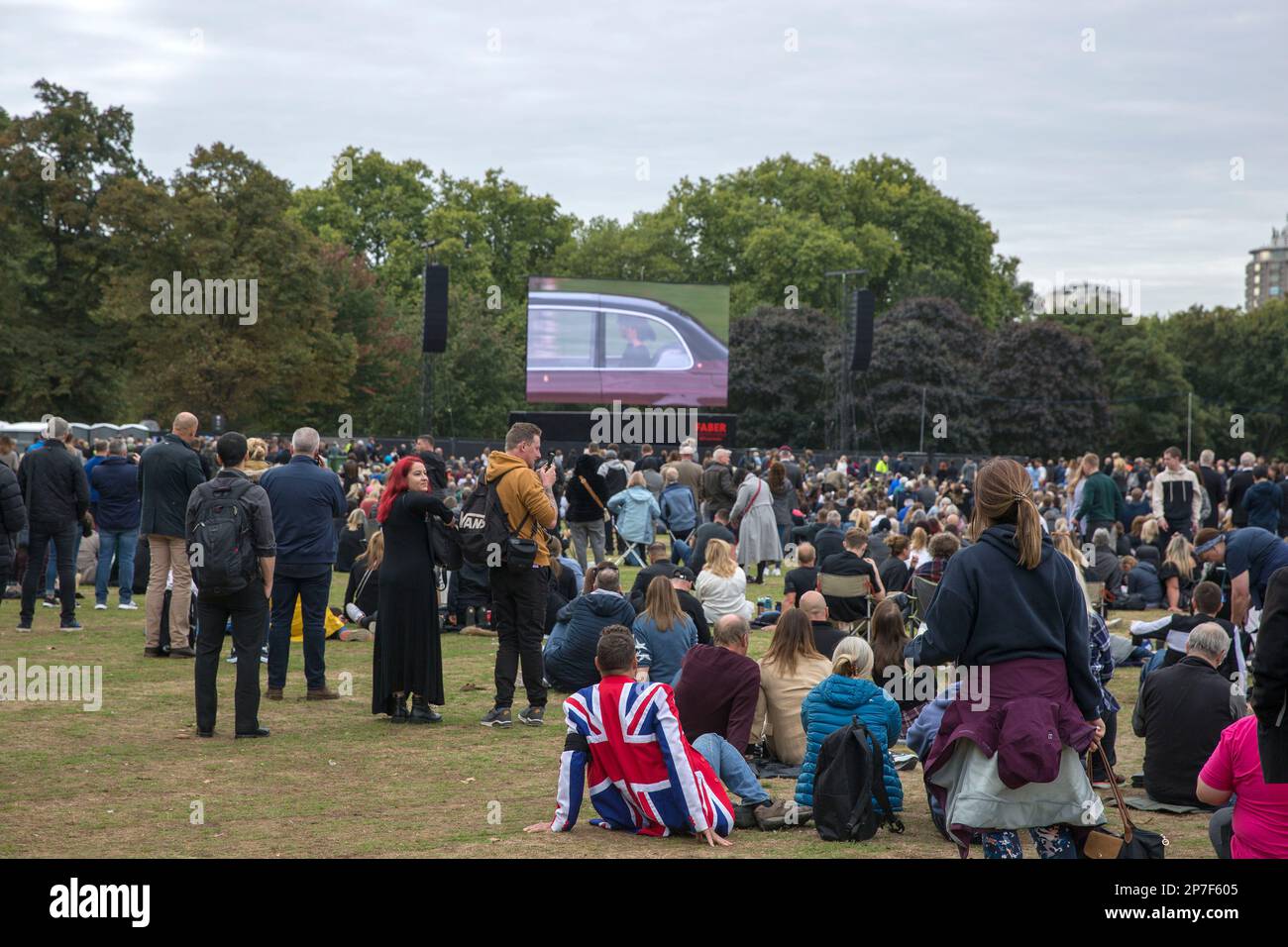 People watch the TV coverage of the late Queen Elizabeth II’s funeral