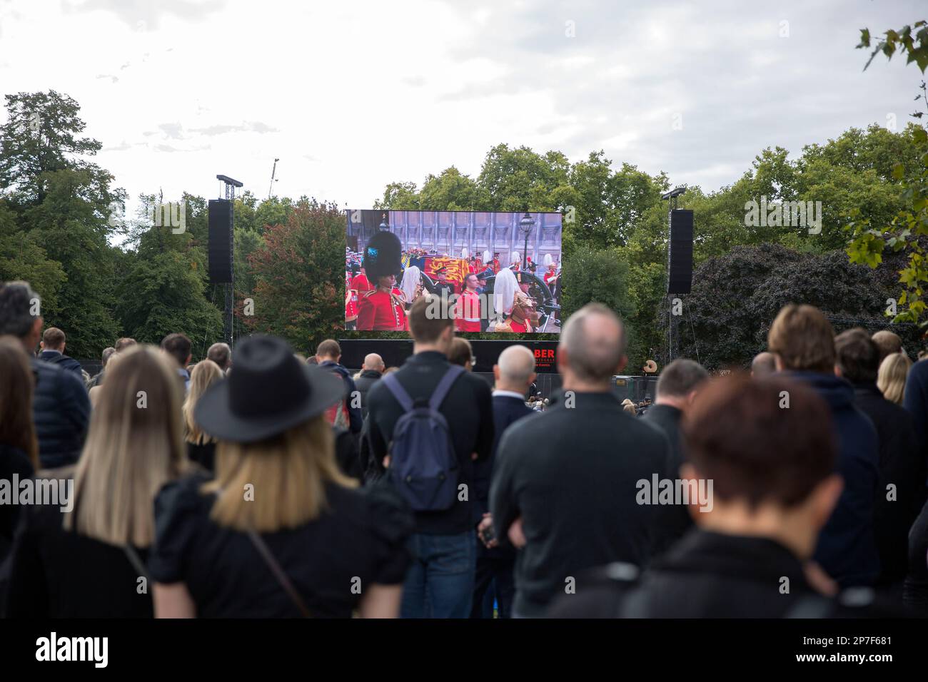 People watch the TV coverage of the late Queen Elizabeth II’s funeral
