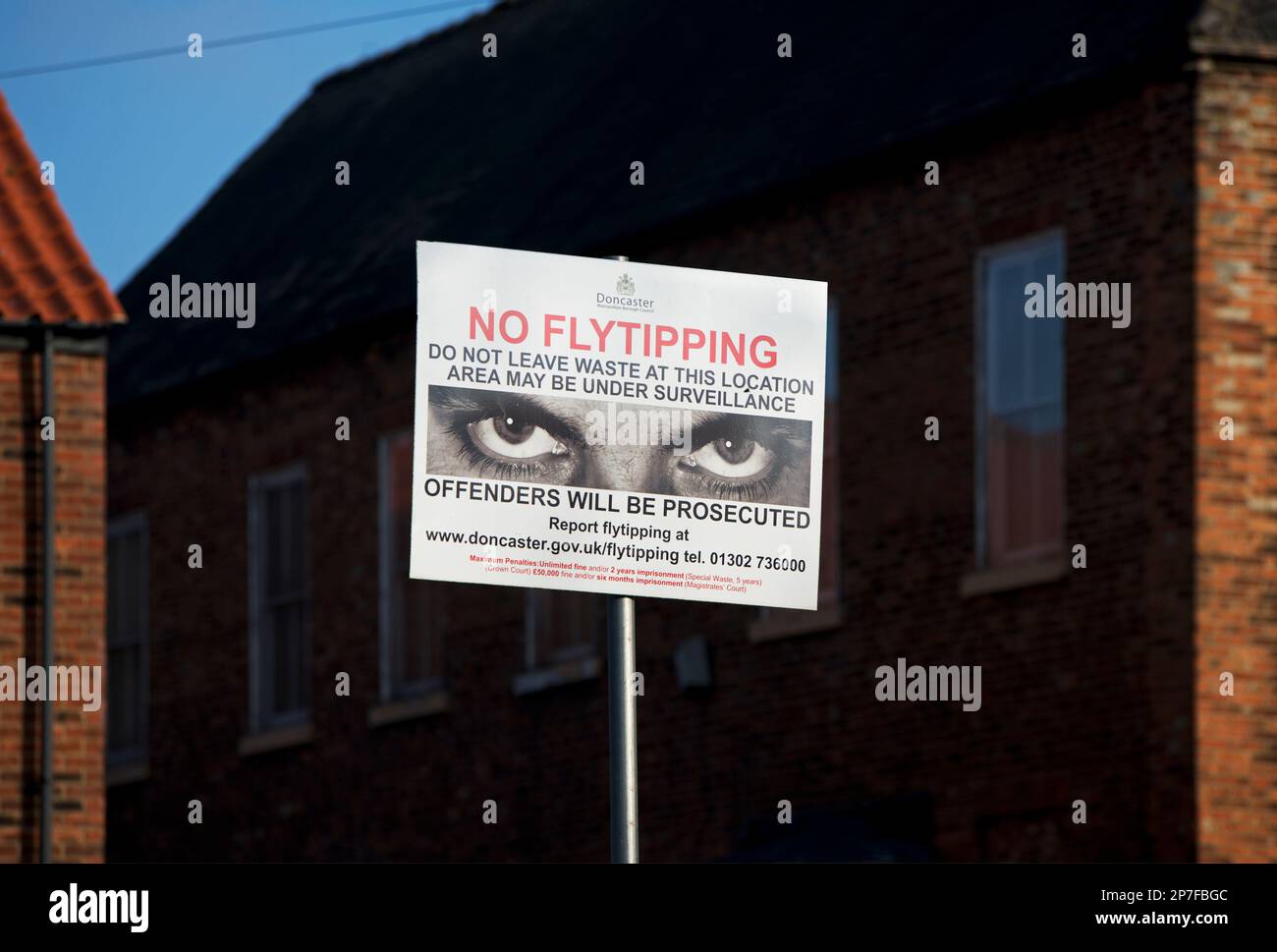 Warning sign – NO FLYTIPPING - in rural setting, England, UK Stock Photo