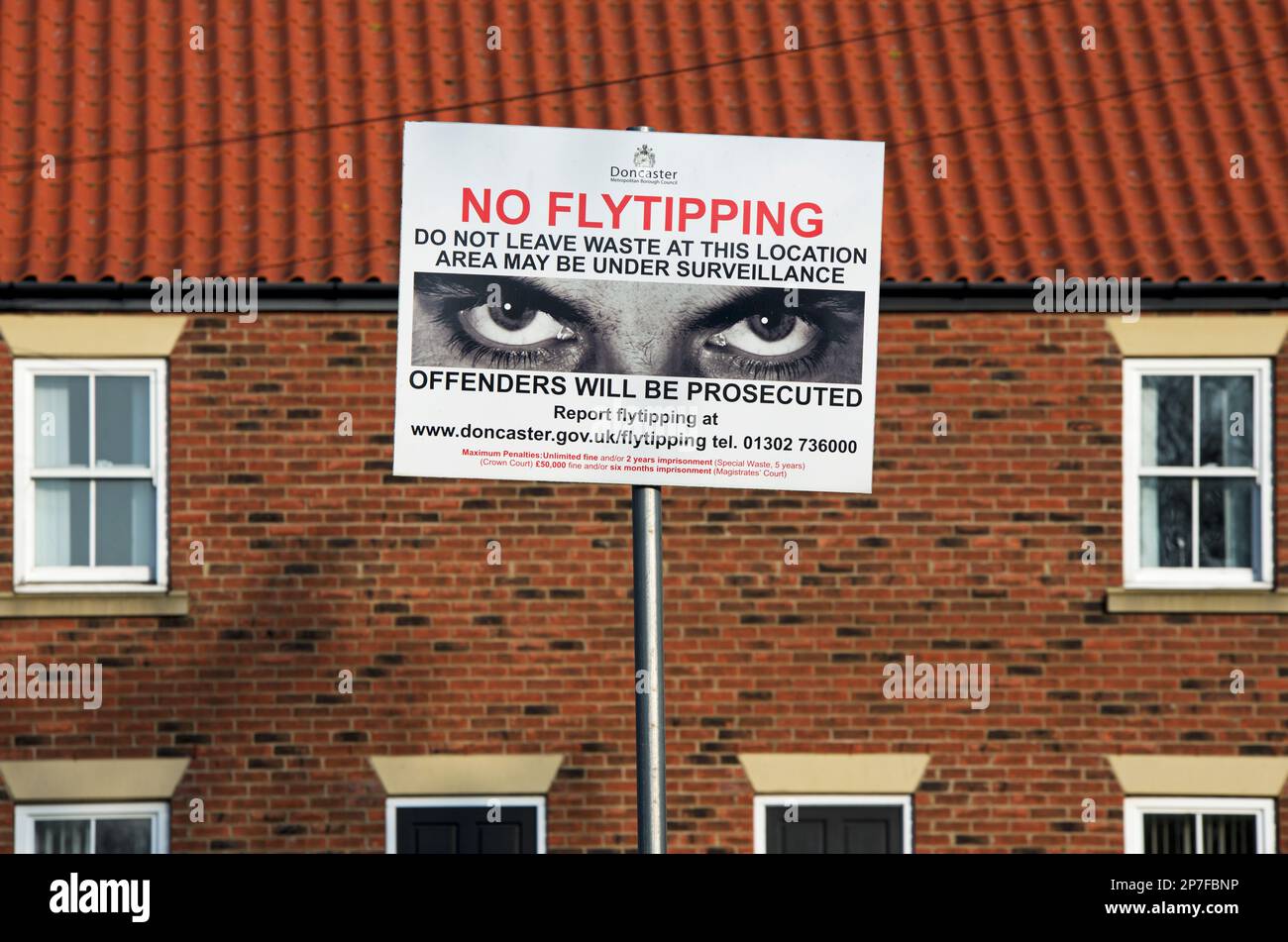 Warning sign – NO FLYTIPPING - in rural setting, England, UK Stock Photo