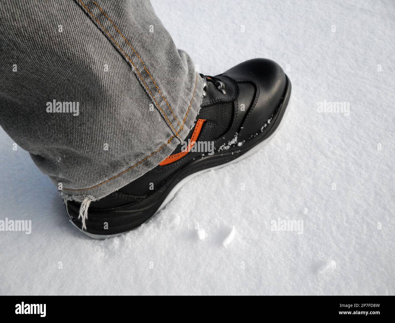 Special boots in the snow. Close-up on a background of snow. Stock Photo