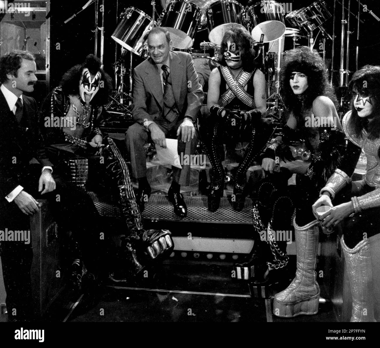 https://c8.alamy.com/comp/2P7FFYN/file-in-this-dec-16-1977-file-photo-nbc-news-correspondent-edwin-newman-third-left-is-surrounded-by-the-rock-group-kiss-from-second-left-gene-simmons-peter-criss-paul-stanley-and-ace-frehley-and-their-manager-bill-aucoin-left-in-new-york-aucoin-who-discovered-the-rock-group-kiss-and-helped-build-them-into-a-musical-and-merchandising-juggernaut-died-of-complications-from-prostate-cancer-on-monday-june-28-2010-in-aventura-fla-he-was-66-ap-photo-file-2P7FFYN.jpg
