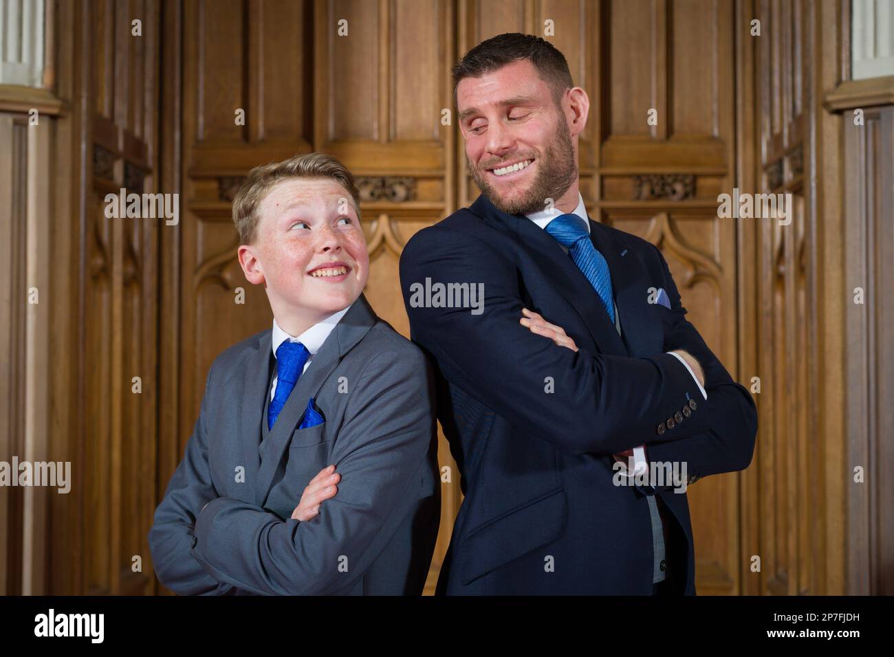 Harry Letts with footballer James Milner at a Windsor Castle ceremony where the boy's former police officer grandfather was posthumously honoured. Picture date: Tuesday March 7, 2023. Stock Photo