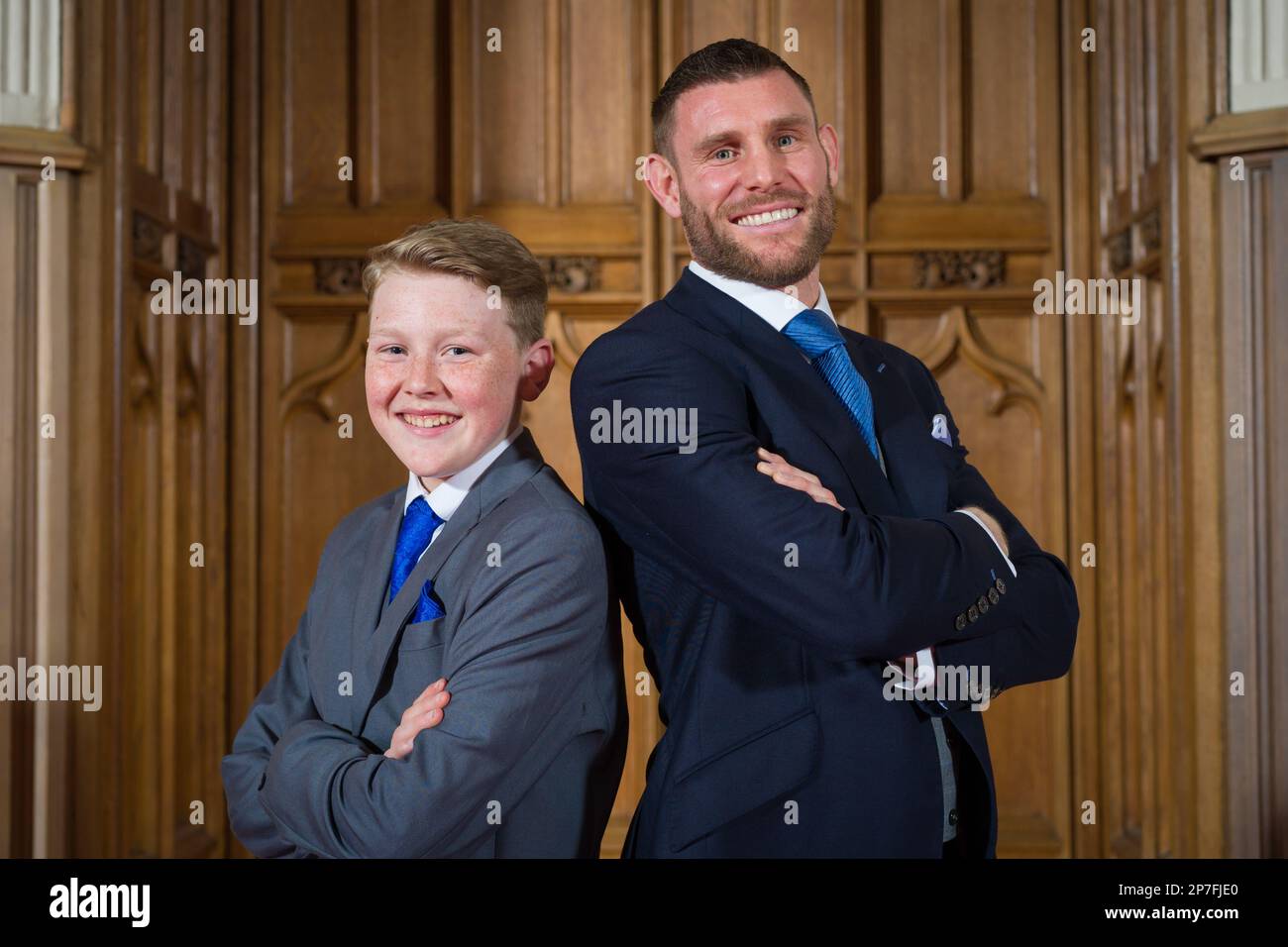 Harry Letts with footballer James Milner at a Windsor Castle ceremony where the boy's former police officer grandfather was posthumously honoured. Picture date: Tuesday March 7, 2023. Stock Photo