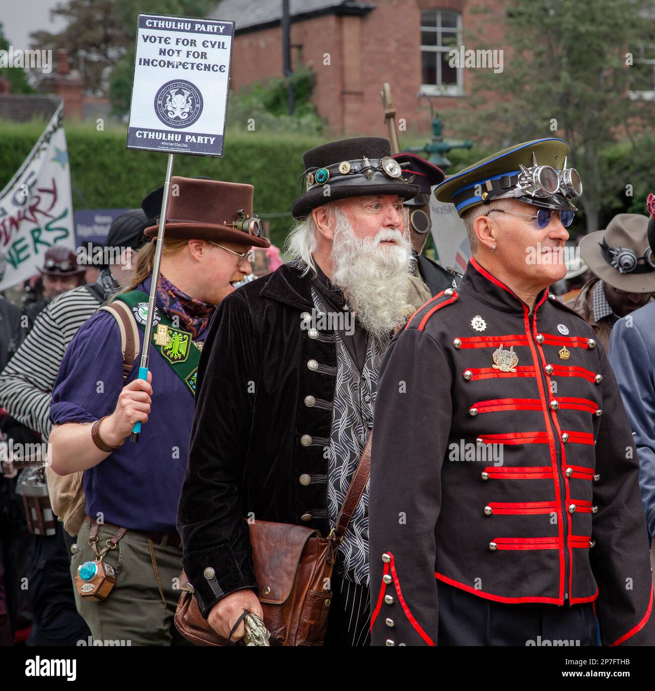 A group of steampunks walking in procession along a street. Stock Photo