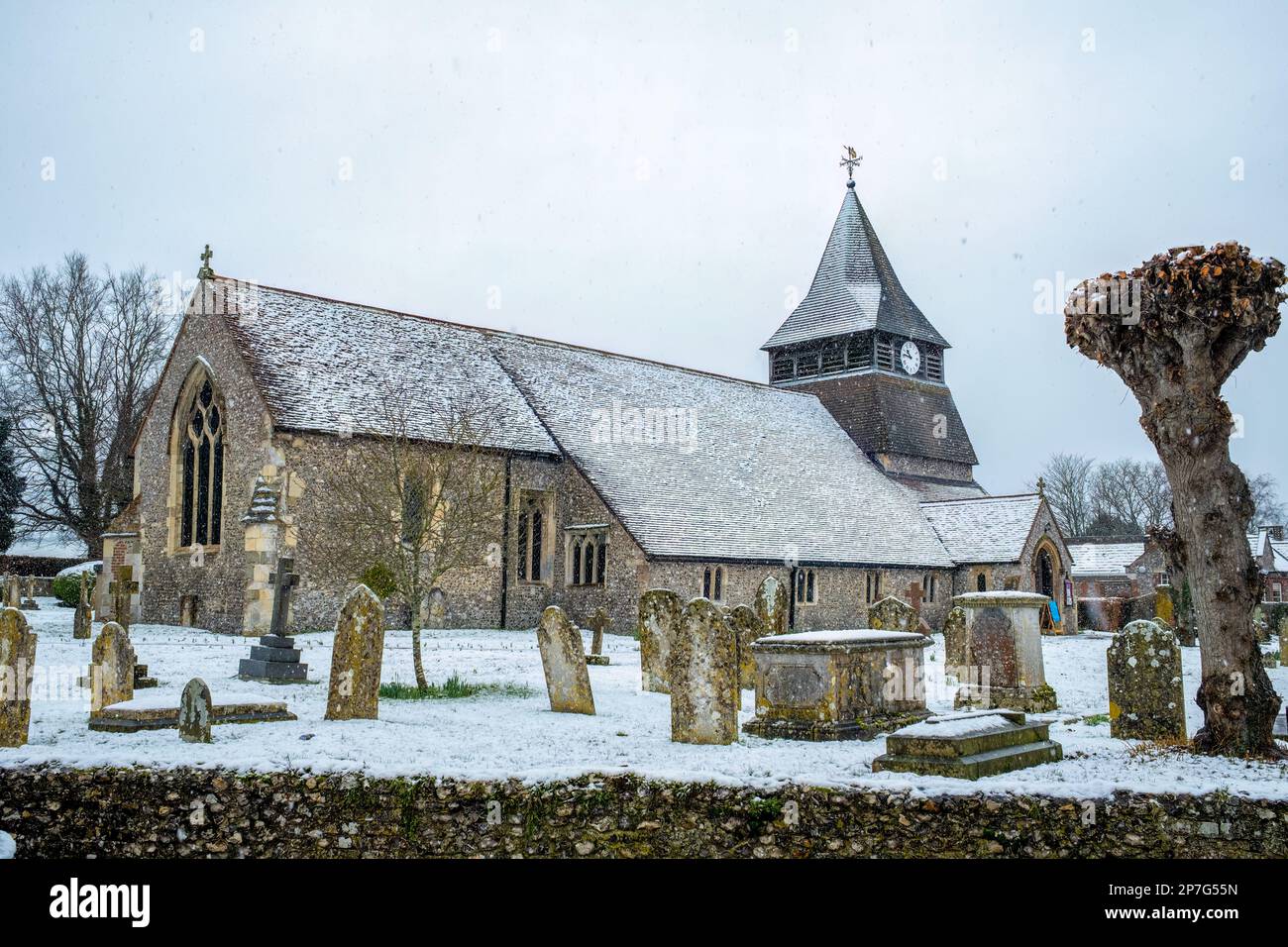 St Peter & St Paul. The parish church in Kings Somborne on a snowy day. Stock Photo