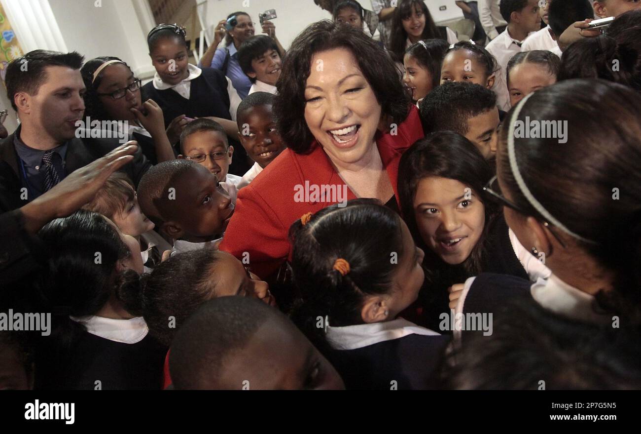 U.S. Supreme Court Justice Sonia Sotomayor, center, reacts as she is