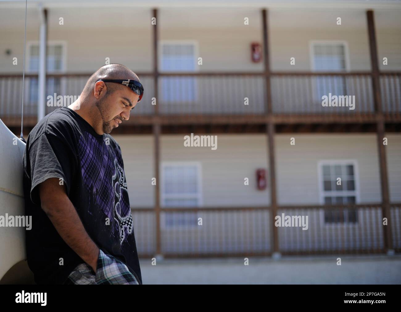 Jesus Saldana, 24, stands outside of the Walnut Creek Apartments where he  was visiting a friend in Dalton, Ga. on April 29, 2010. Saldana has been  unemployed for the last two years.