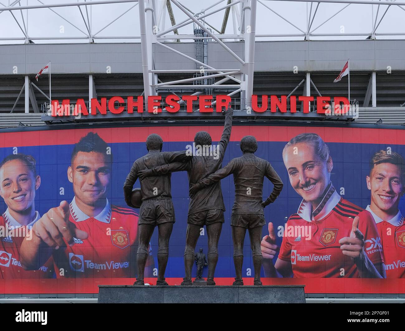 Trinity Statue of George Best, Bobby Charlton, and Denis Law outside of Manchester United FC, Old Trafford, Manchester, UK Stock Photo