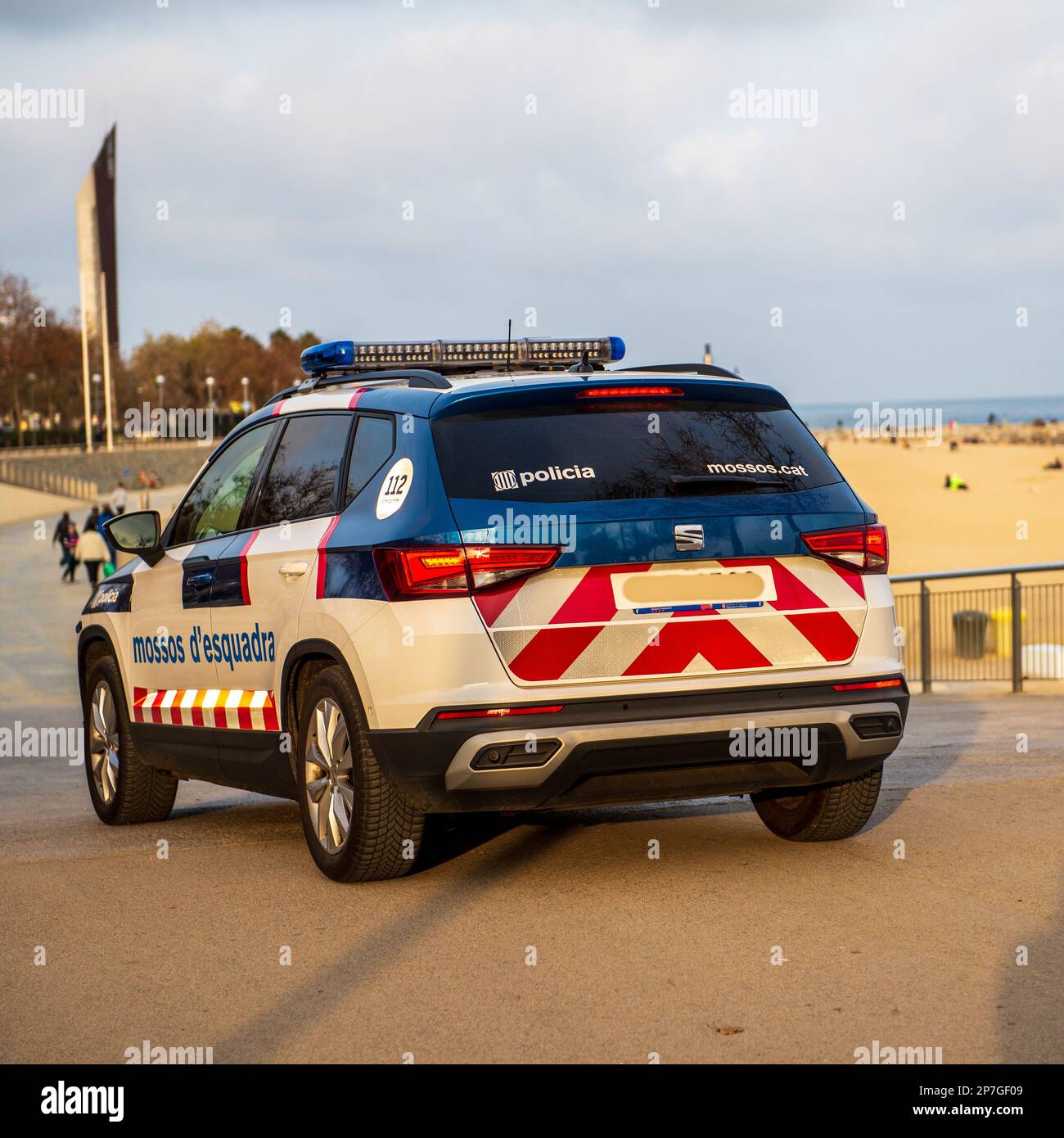 Barcelona,Spain-February 22,2023: A police car patrols the beach late in the afternoon Stock Photo