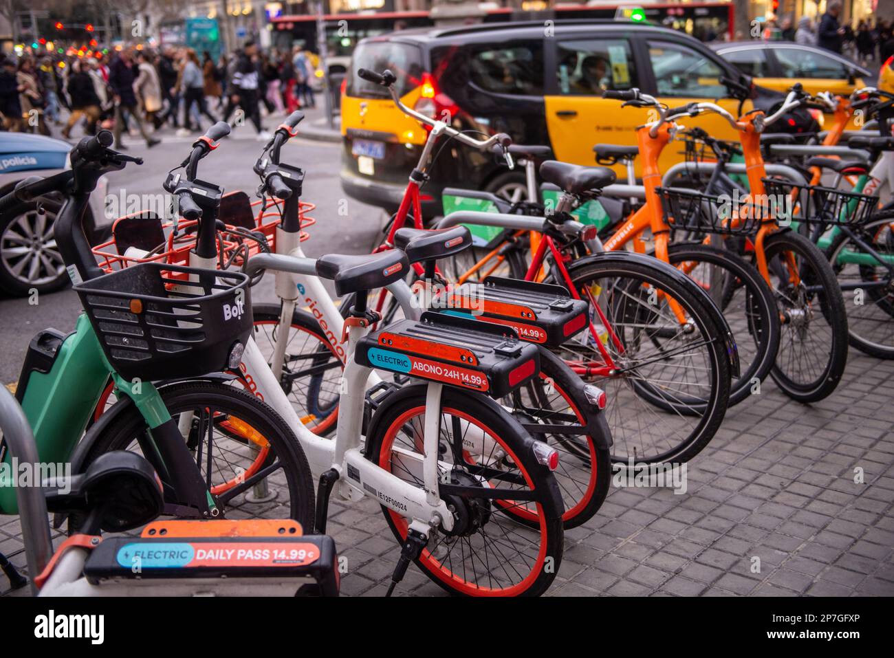 Ebikes lined up for rent on a busy street Stock Photo - Alamy