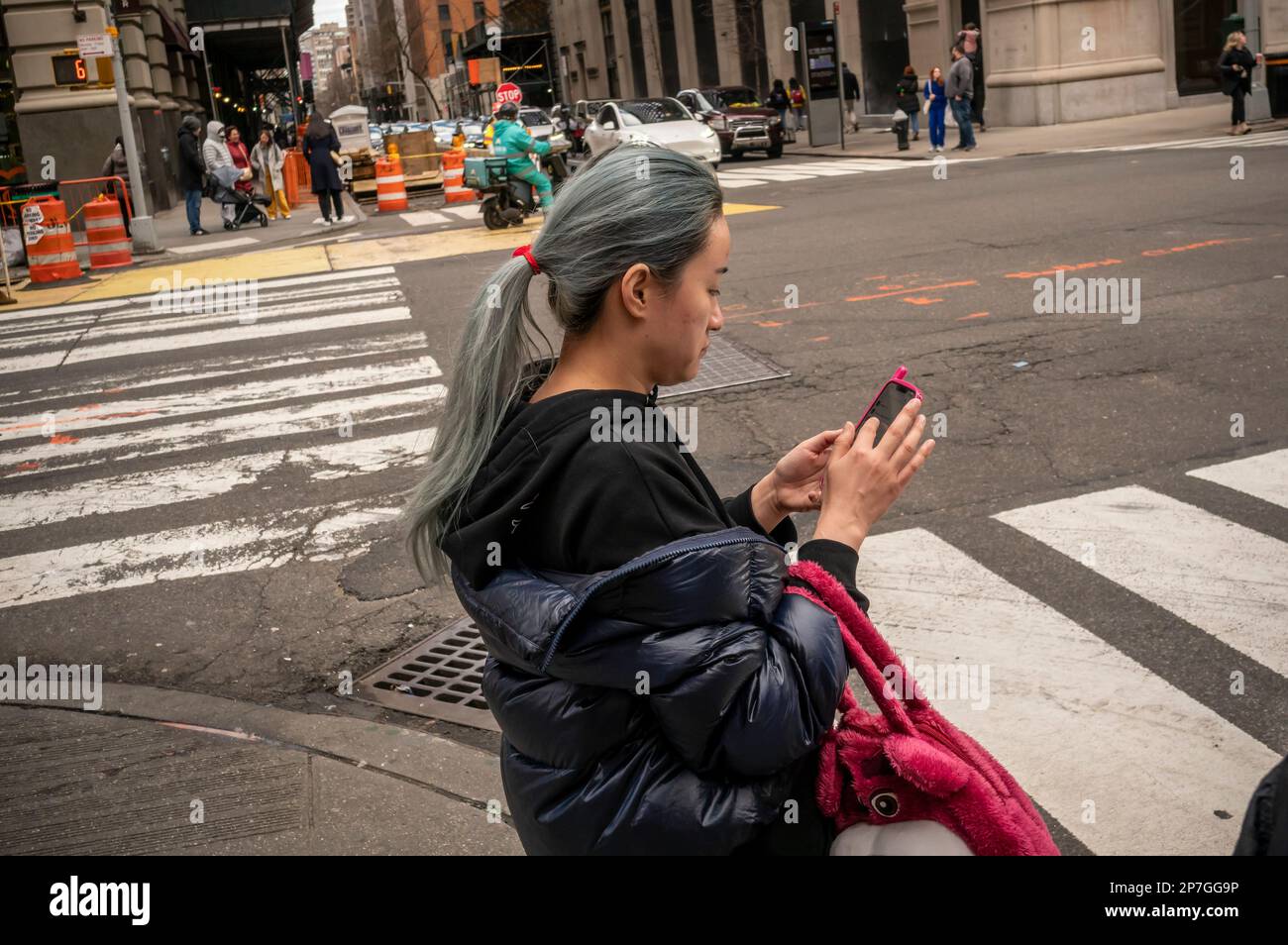 Distracted woman in the NoMad neighborhood in New York on Sunday, March 5, 2023. (© Richard B. Levine) Stock Photo