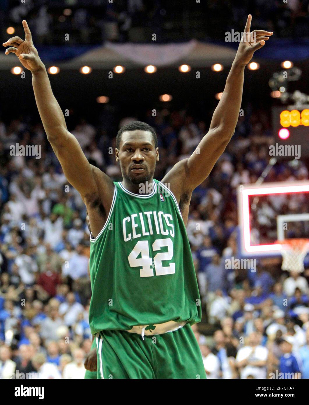 Boston Celtics guard Tony Allen raises his arms as he walks off the court  after the Celtics defeated the Orlando Magic 95-92 in Game 2 of the NBA  Eastern Conference basketball finals