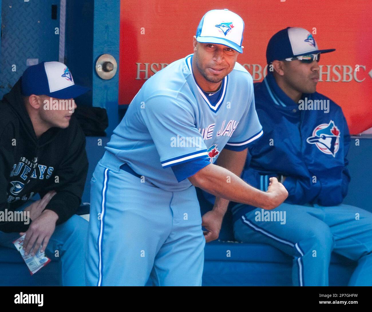 Toronto Blue Jays center fielder Vernon Wells, center, flexes a