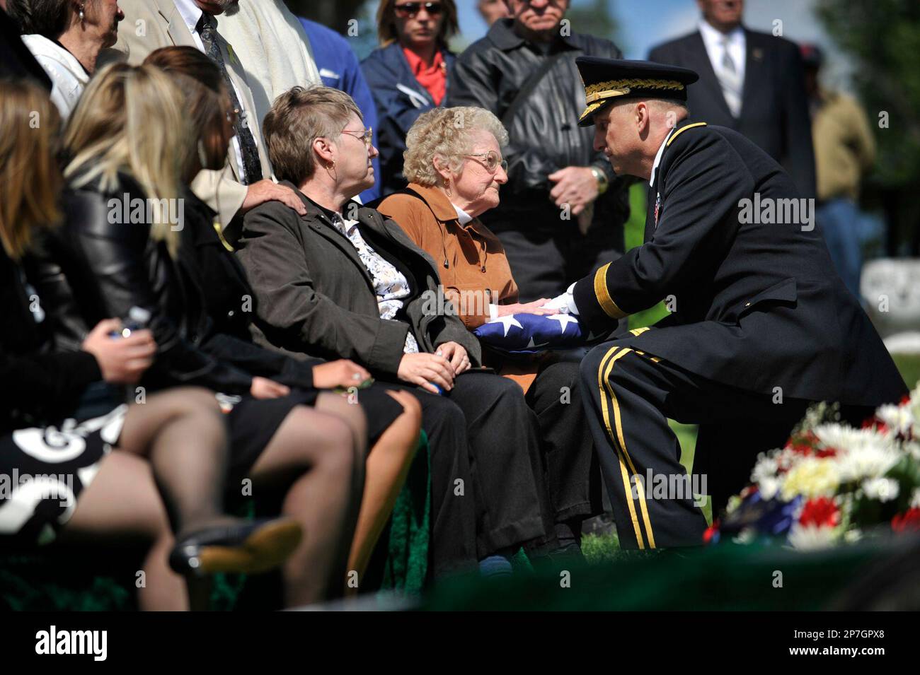 Mary Lou Kennedy, the grandmother of Sgt. Nathan Kennedy, is presented