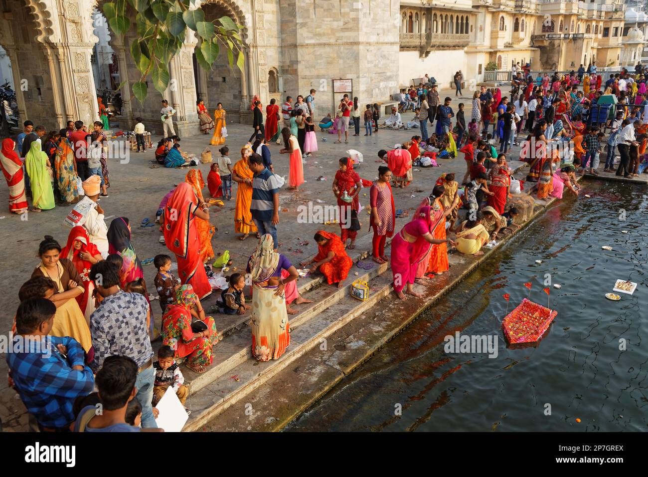 UDAIPUR, INDIA, November 4, 2017 : People during a ceremony. On the full moon day, an Hindu ceremony of light stands on banks of the lake of Udaipur Stock Photo