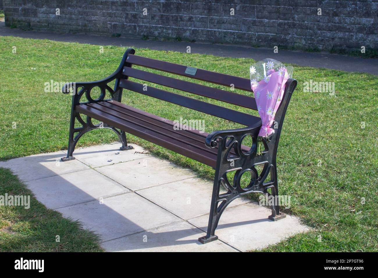 8 March 2023 Ballyholme Promenade Bangor County Down Northern Ireland. A bench erected in the memory of a young loved one lost to cancer Ballyholme Pr Stock Photo