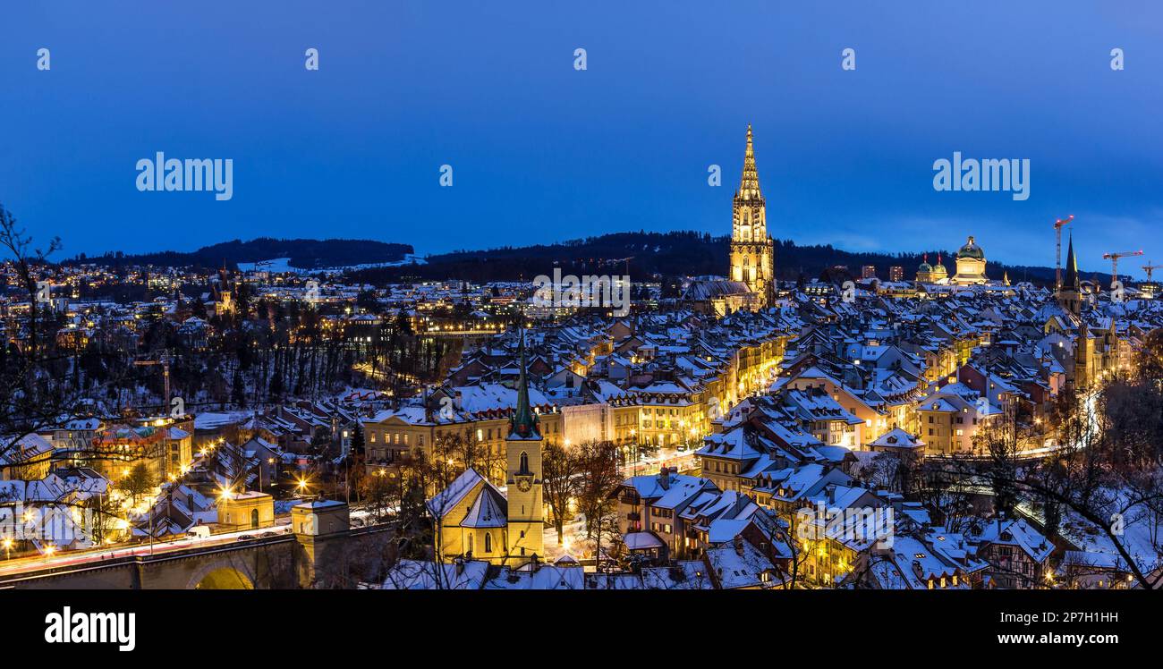 Panorama of the town center of Bern in winter blue hour with snowy and illuminated buildings, Rosengarten, Bern, UNESCO, Switzerland Stock Photo