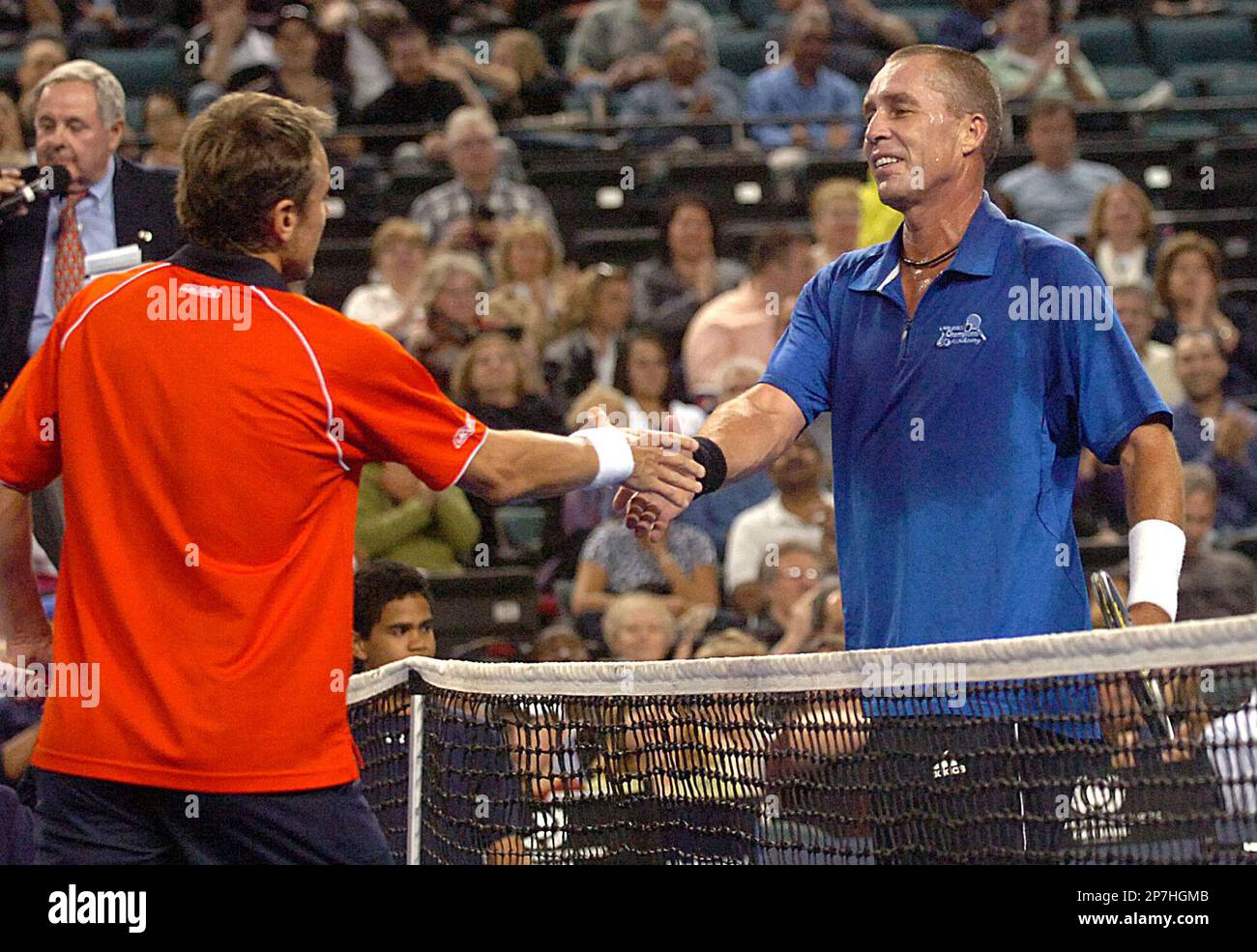 Mats Wilander, left, and Ivan Lendl shake hands after the first match