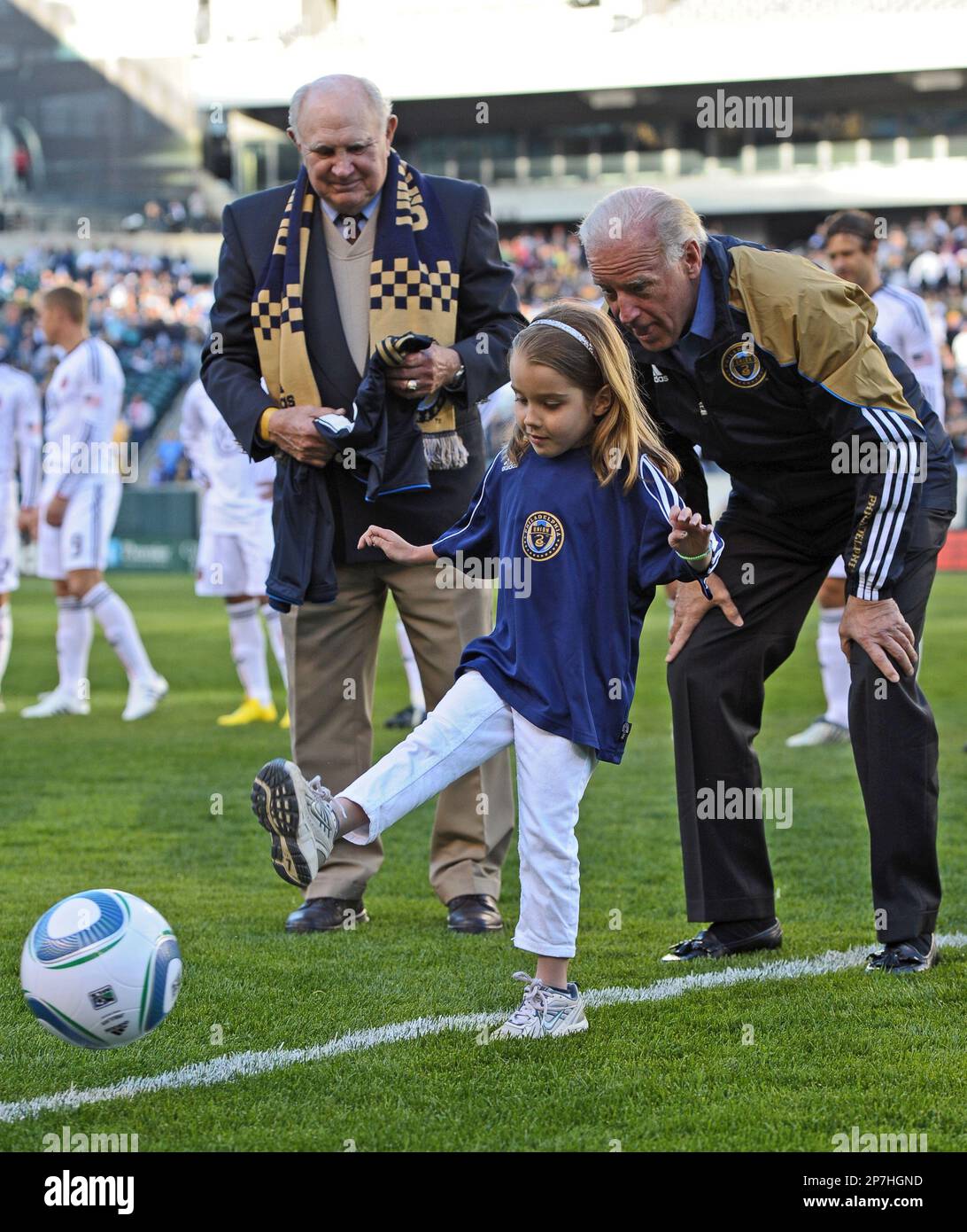 Vice President Joe Biden watches his granddaughter Natalie Biden, 5, kick out the first ball before an MLS soccer match between the Philadelphia Union and D.C. United, Saturday, April 10, 2010, in Philadelphia. (AP Photo/Drew Hallowell, POOL) Stock Photo