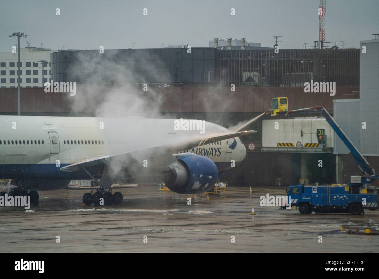 London, UK. 8 March 2023. A British Airways  passenger aircraft  is  sprayed green with De-Icing liquid at Gatwick airport to remove snow and ice . A weather warning has been issued as an Artic blast hits many parts of the UK with freezing temperatures causing travel delays at airports.  Credit: amer ghazzal/Alamy Live News. Credit: amer ghazzal/Alamy Live News Stock Photo