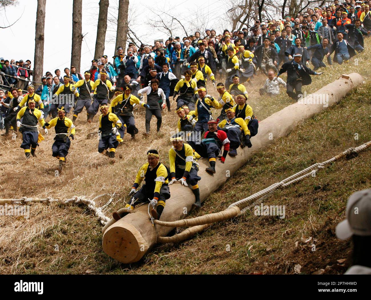 Shrine parishioners ride a log called 