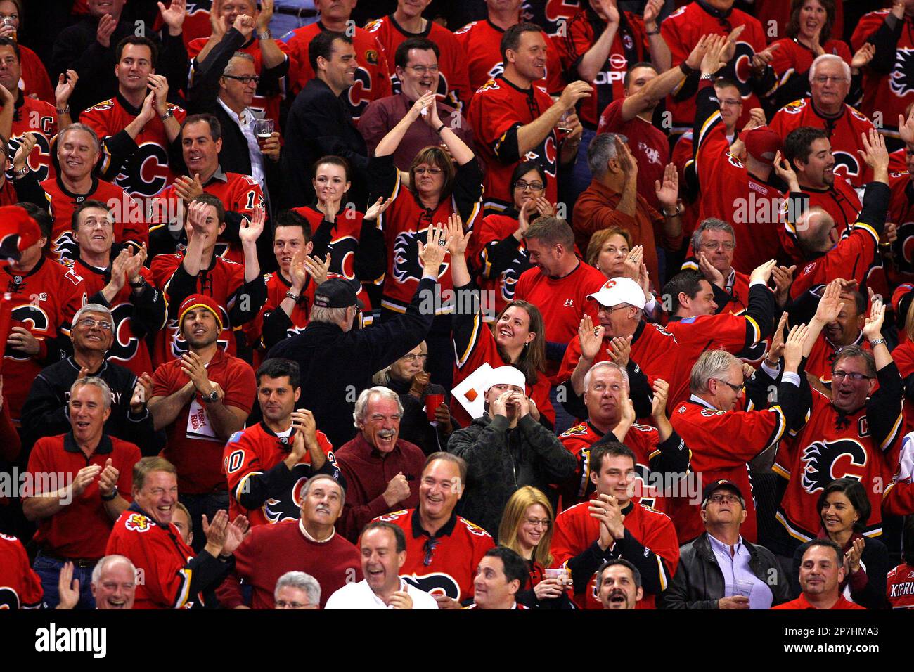 Calgary Flames' mascot Harvey the Hound in a sea of red with fans during a  recent NHL playoff hockey game in Calgary. Larry MacDougal/TCPI/The  Canadian Press (Canadian Press via AP Images Stock