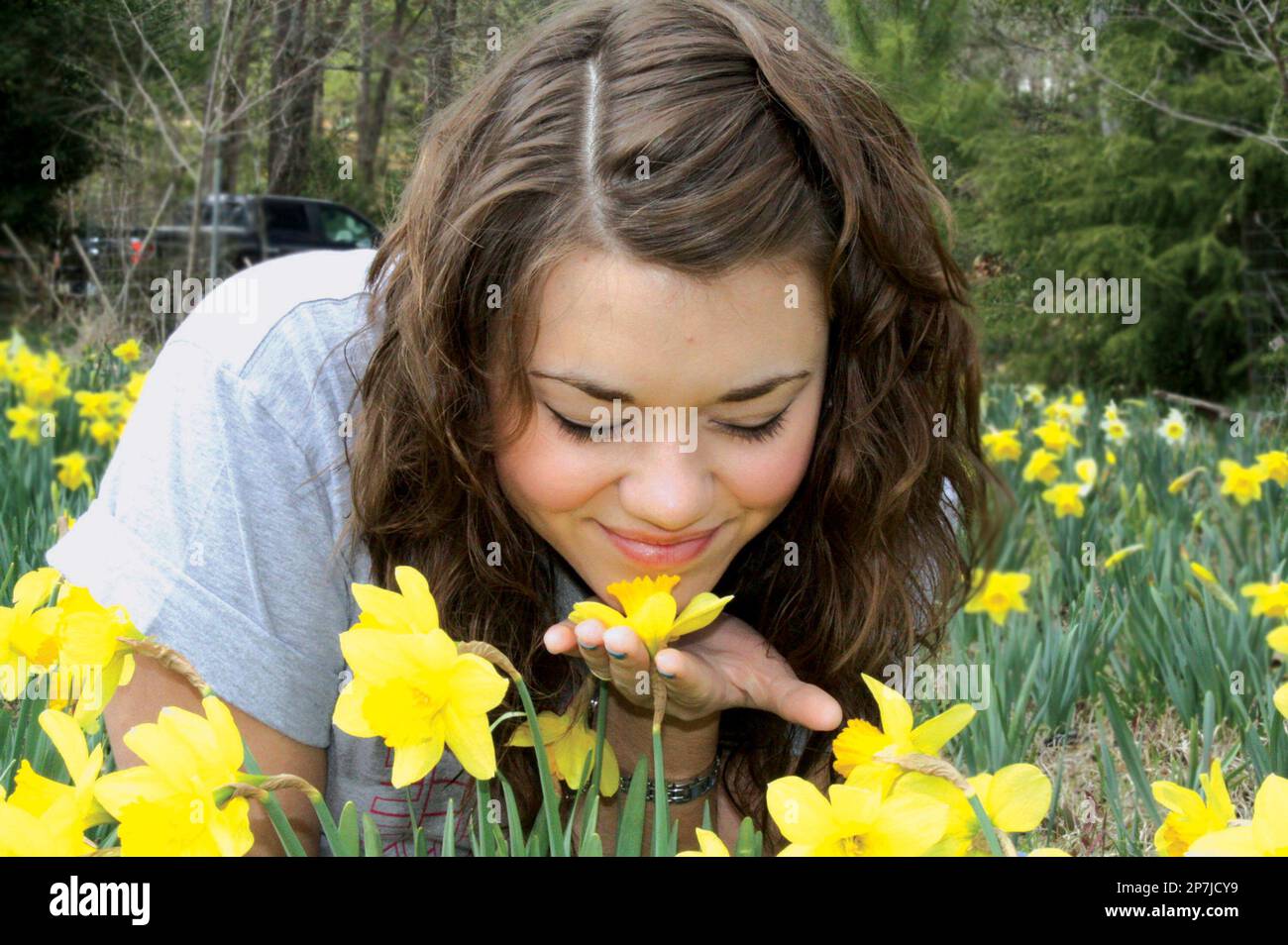 Hannah Bailey of Bearden, Ark., smells daffodils at The Daniel Garden