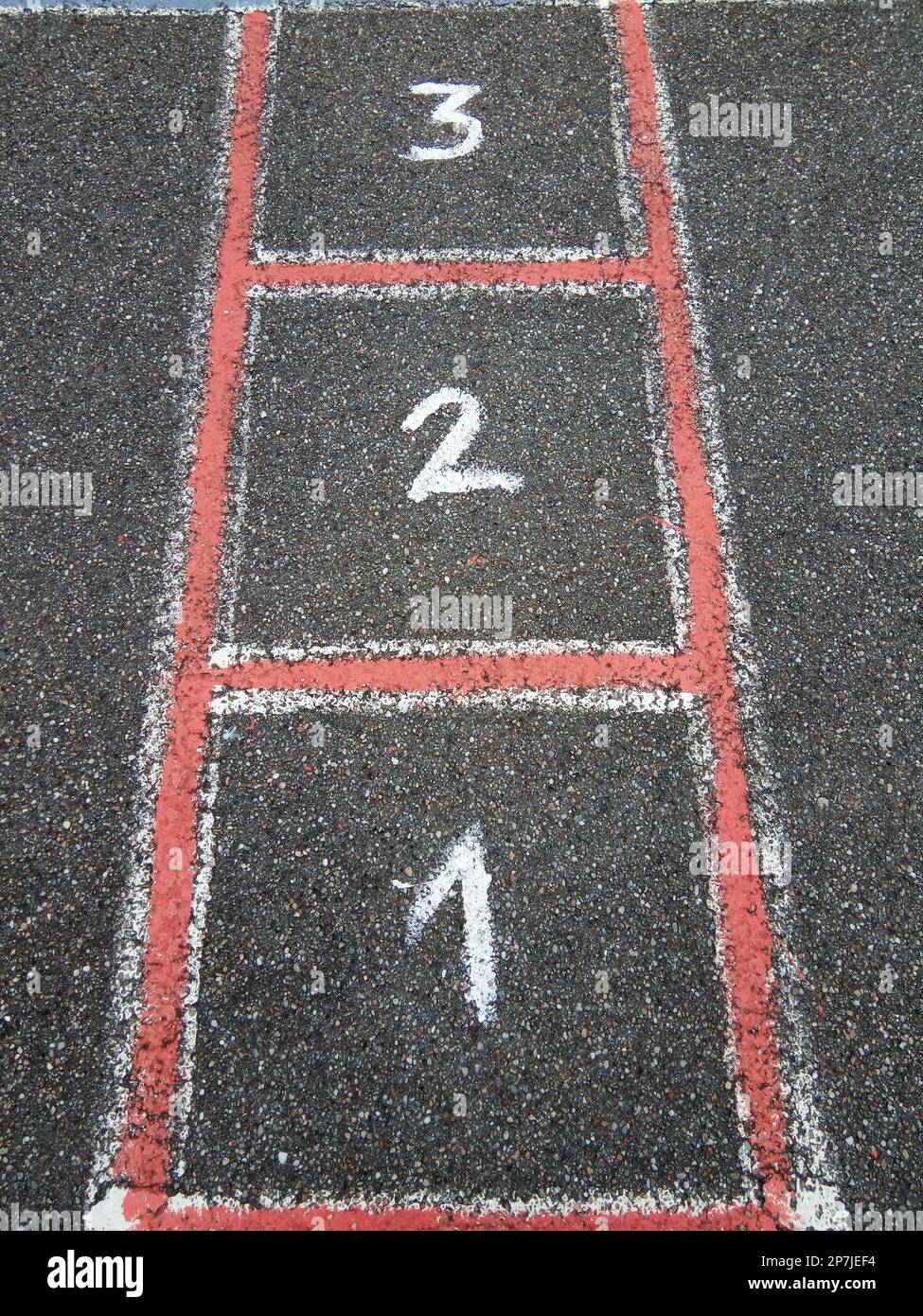 numbers one, two and three painted on asphalt Stock Photo