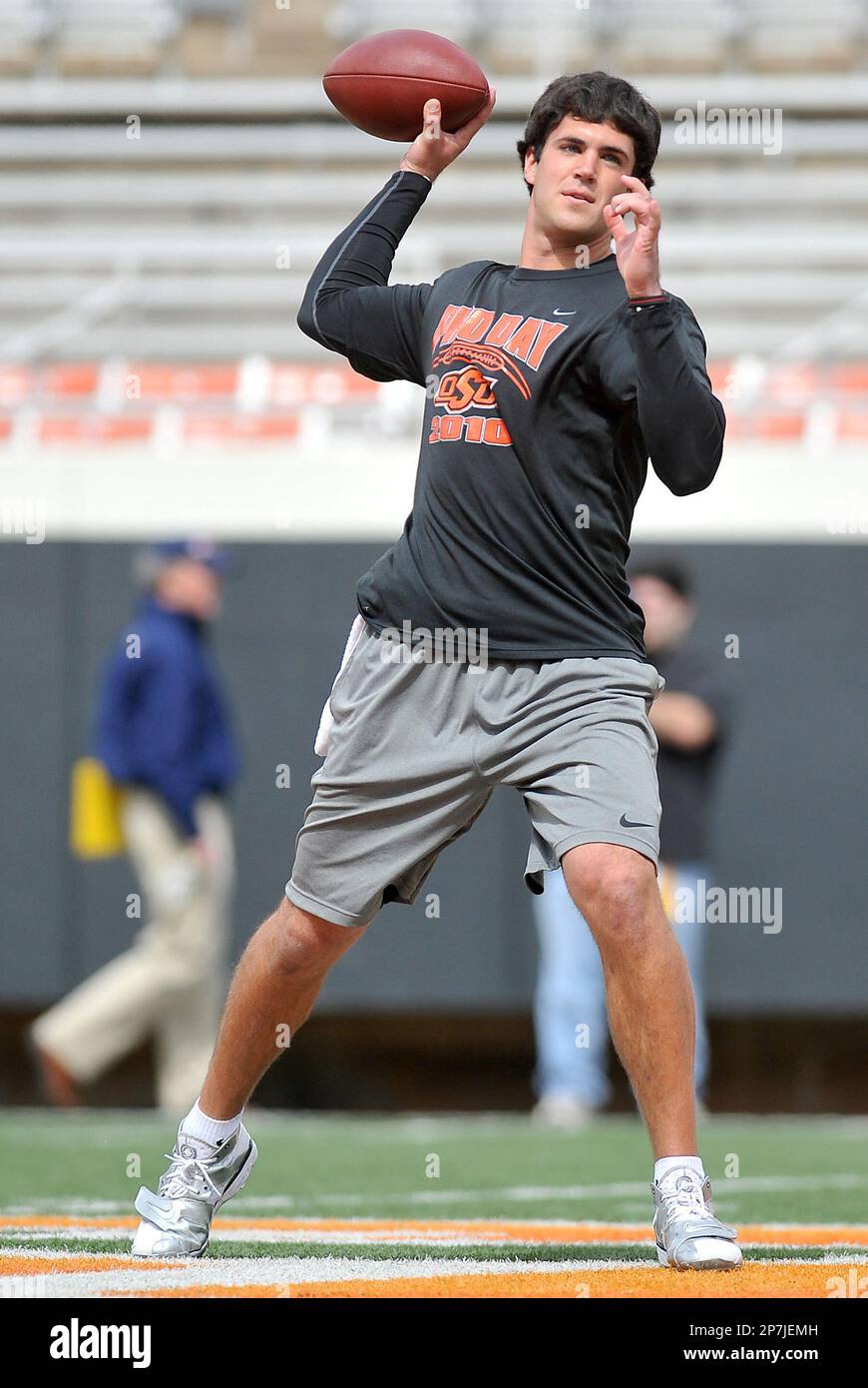 Former Oklahoma State football player Zac Robinson throws the ball for