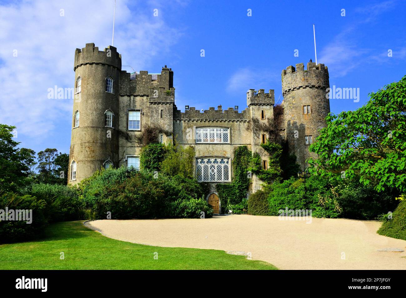 View of the medieval Malahide Castle with green front garden, Dublin