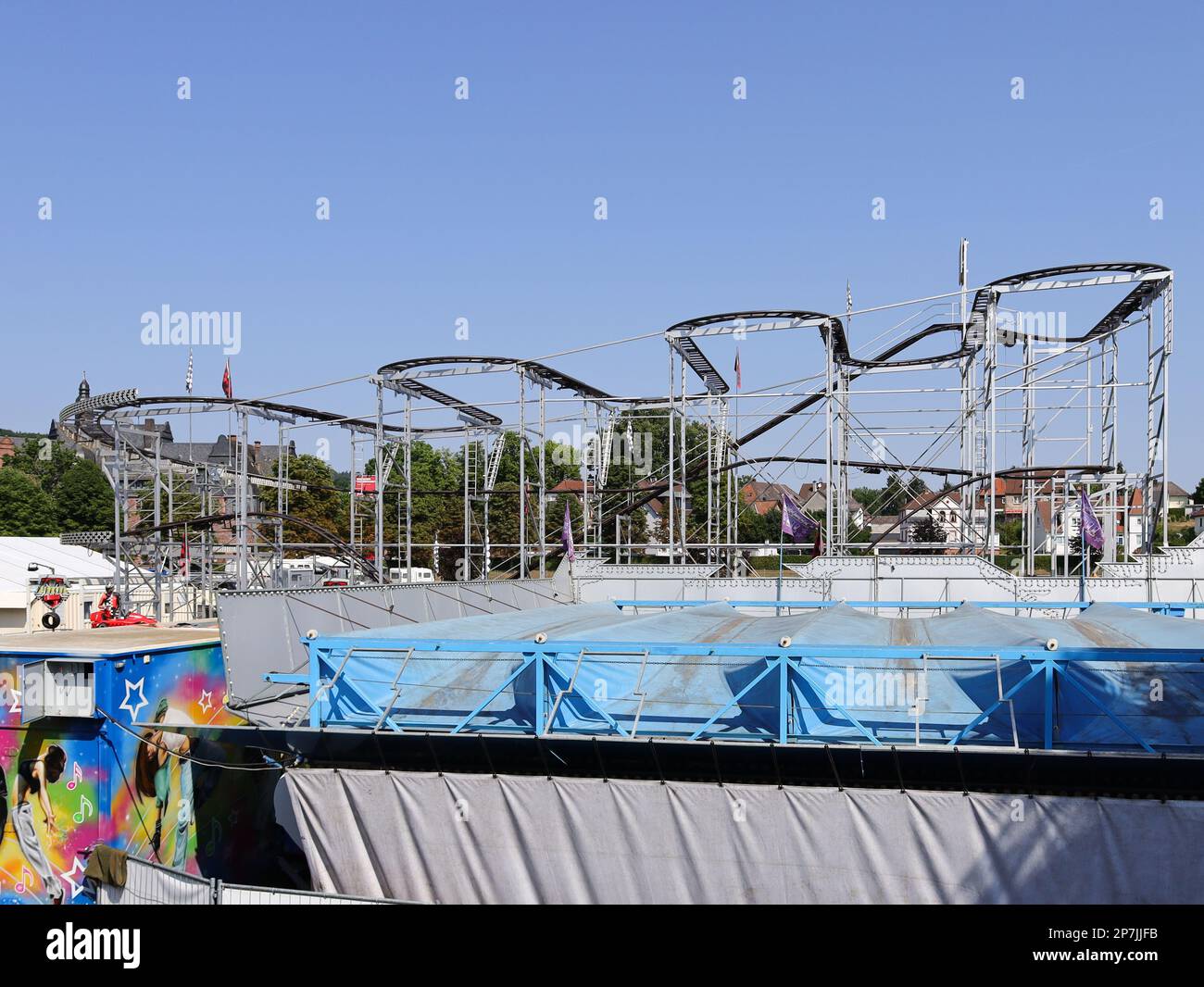 colorful booths and fun rides at a fairground Stock Photo - Alamy