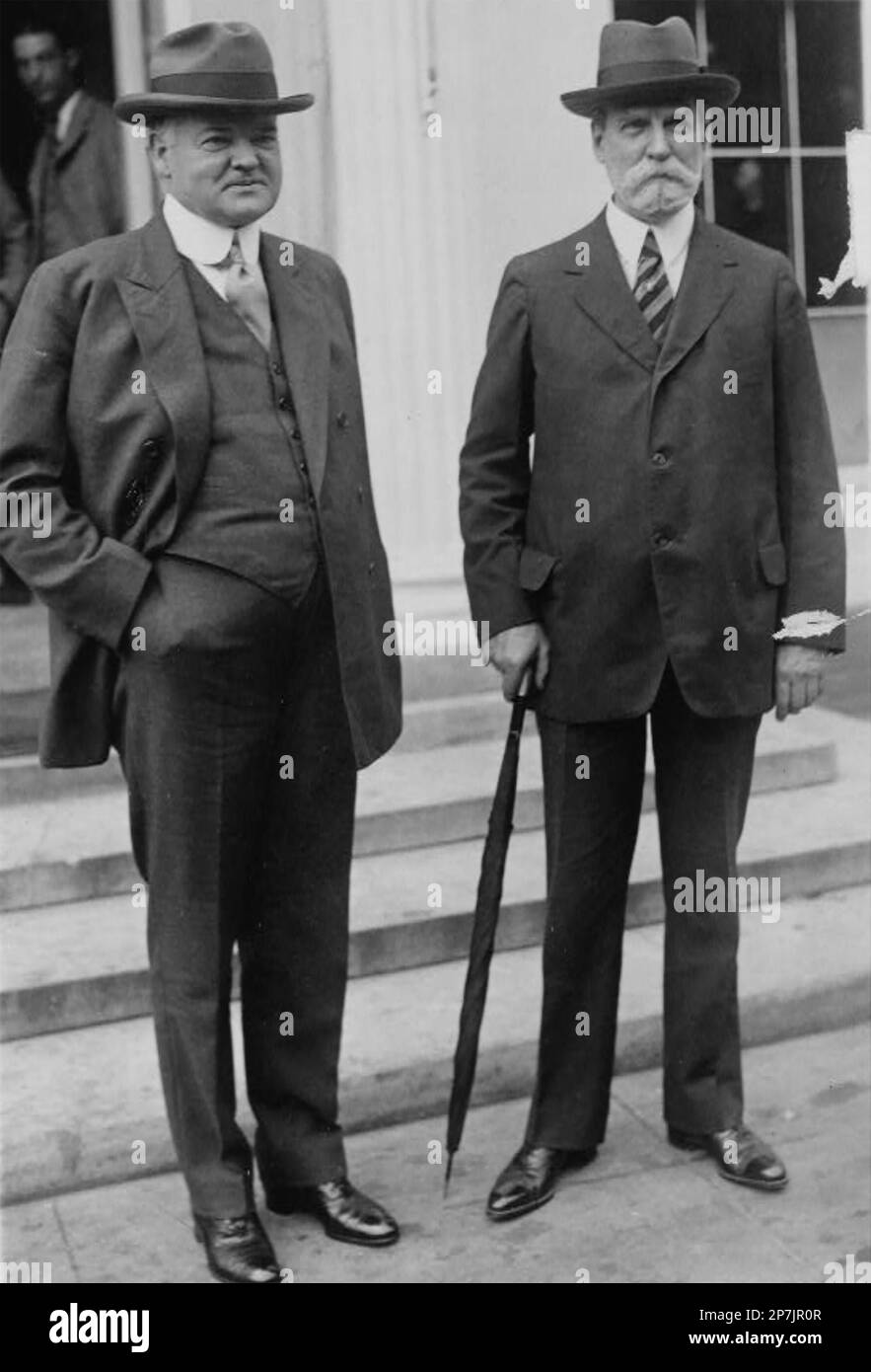AMERICAN PRESIDENT HERBERT HOOVER (1874-1964) at left with his  Secretary of State Charles Hughes about 1921 Stock Photo