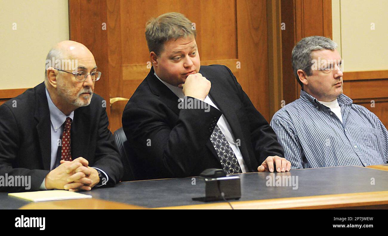 Attorneys James Gibson, left, and Jason Pfeil are shown with defendant