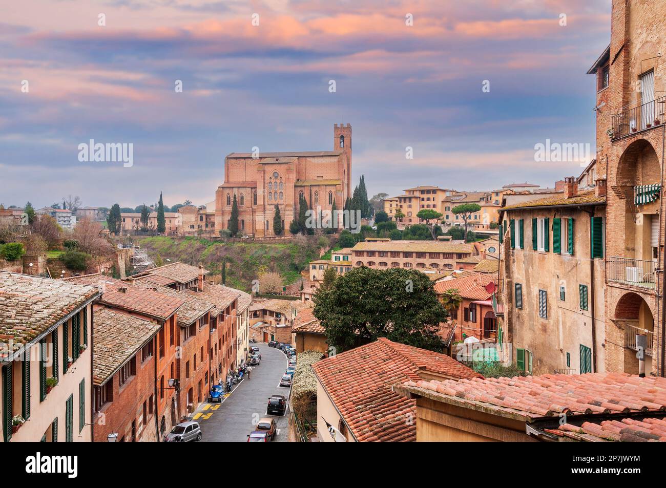 Panorama of the city of Siena and the Basilica of San Domenico under a stormy and very busy sky, in Tuscany, Italy Stock Photo